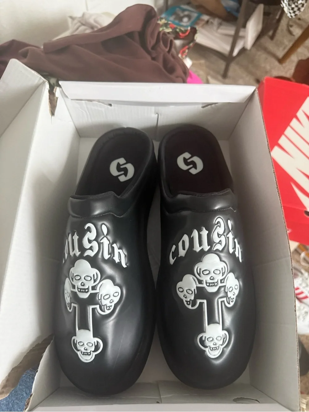 Cousin’s custom Black Slip-On Graphic Clog Shoes with Skull Design